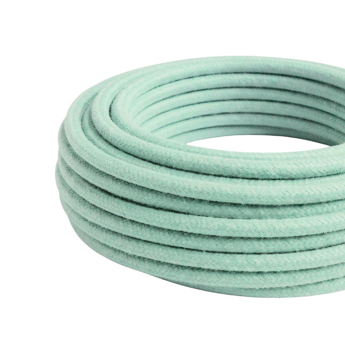 Câble textile rond en coton Lait menthe – rouleau vu de trois quarts