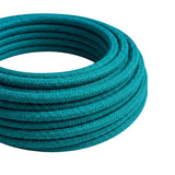 Câble textile rond en coton Céruléen – rouleau en gros plan