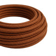 Câble textile rond en coton Marron cannelle – rouleau en gros plan