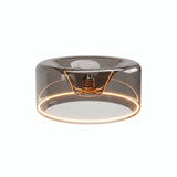 Ampoule LED donut E27 en verre fumé Ø 195 mm allumée, anneau lumineux ambré, fond blanc