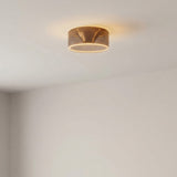 Ampoule LED donut E27 en verre fumé Ø 195 mm allumée au plafond d'une pièce aux murs clairs