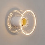 Ampoule LED donut E27 en verre transparent Ø 120 mm allumée en applique murale dans un décor minimaliste