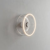 Ampoule LED donut E27 en verre transparent Ø 195 mm allumée en applique murale dans un intérieur épuré