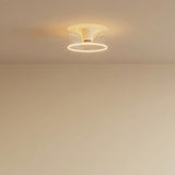 Ampoule LED donut E27 en verre transparent Ø 195 mm allumée au plafond d'un intérieur épuré