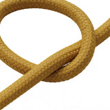 Gros plan du câble textile uni, effet soie jaune moutarde