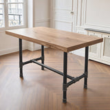 Piètement de table à manger en H, fonte et acier vernis Ø 42 mm, en situation sous un plateau épais en chêne massif