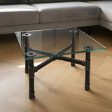 Piètement de table basse en croix, fonte et acier vernis Ø 34 mm, en situation sous un plateau en verre trempé